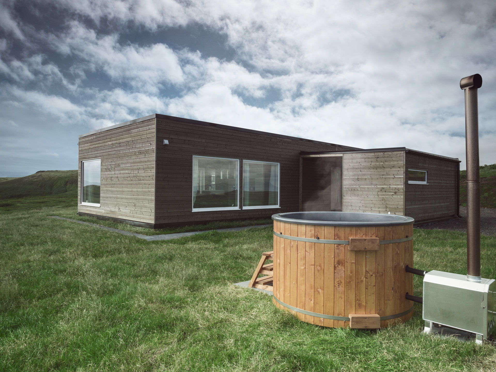 The hot tub of hrifunes nature park on a lovely summers day in south iceland